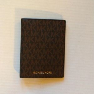 NWOT. Michael kors passport.